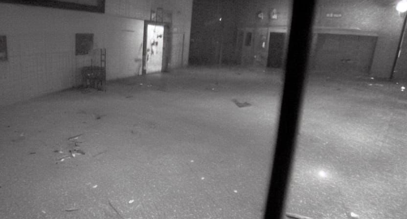 Creepy Humanoid Figure on Abandoned Stage