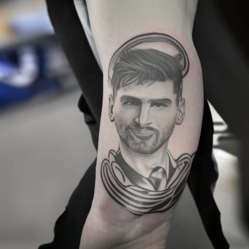 Realistic Tattoo of Soccer Player on Man's Arm