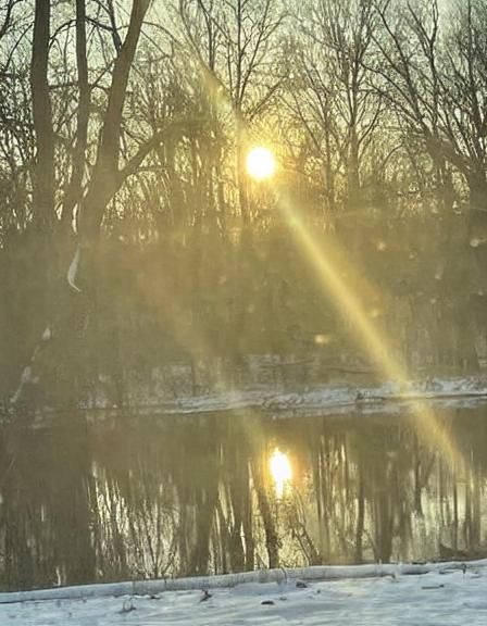 Snowy Sunset Reflection in Golden Sunlight