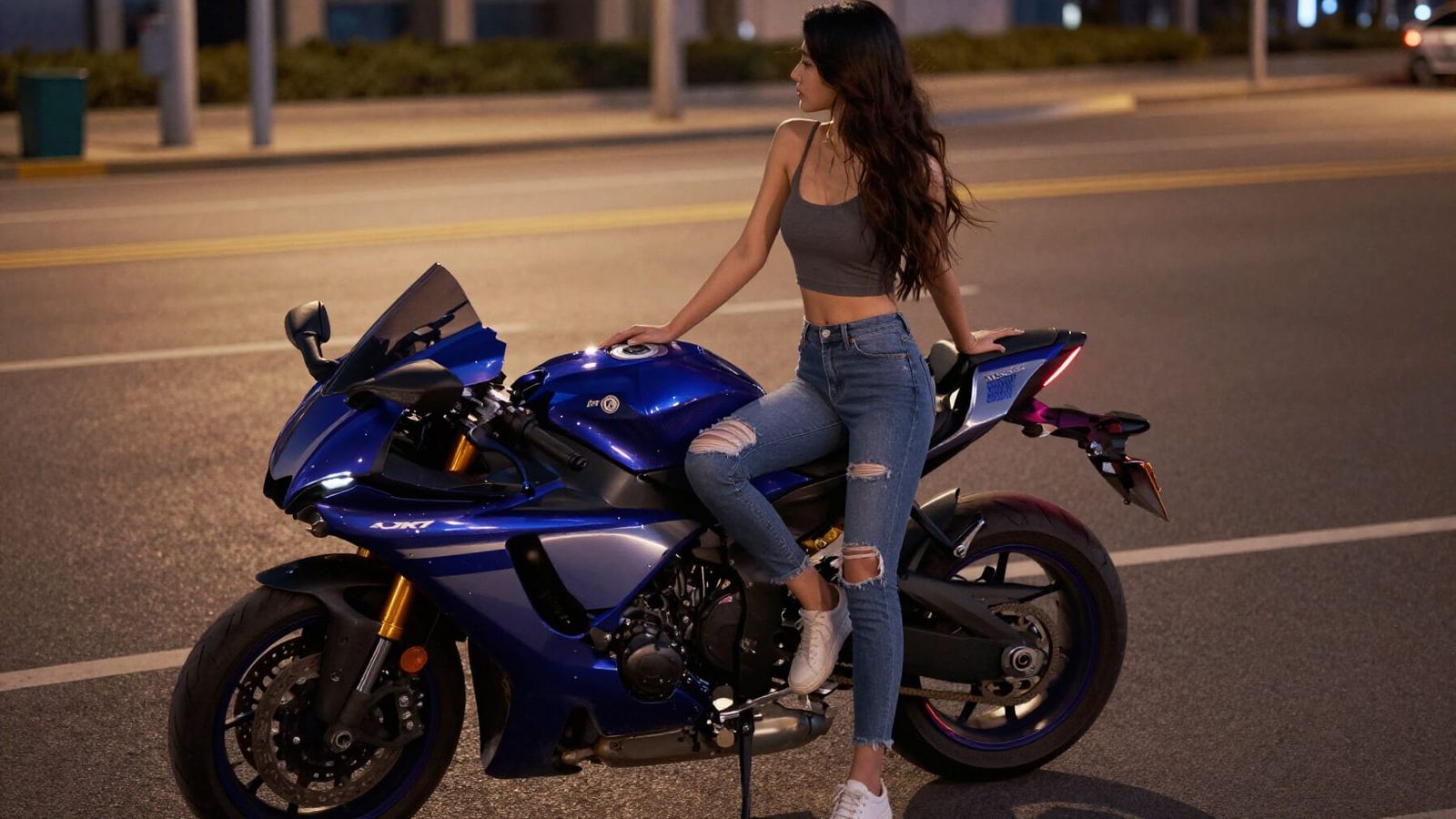 Woman on Motorcycle at Night in Neon City