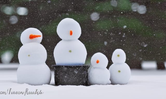 Snowmen Campfire Gathering in Snowstorm