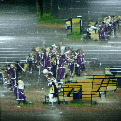 Marching Band Plays Energetically in the Rain