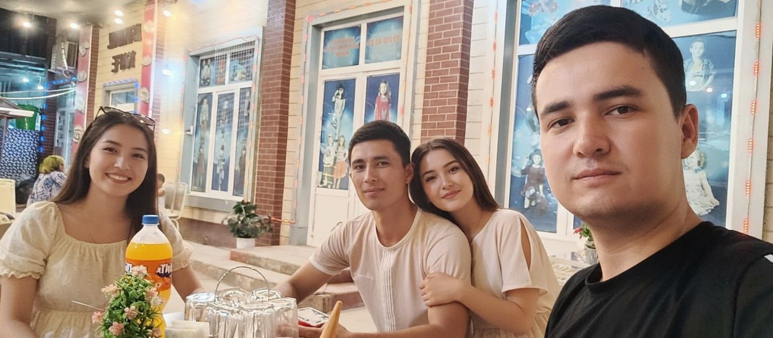 Man in Black T-Shirt Surrounded by Adoring Girls