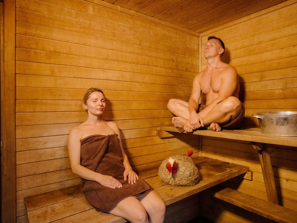Woman and Rooster in Sauna: Cinematic Still Life