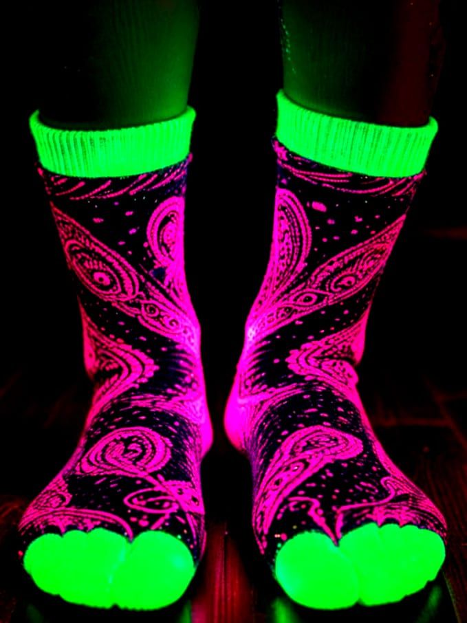 Neonpunk Paisley Socks Glow on Dancing Woman
