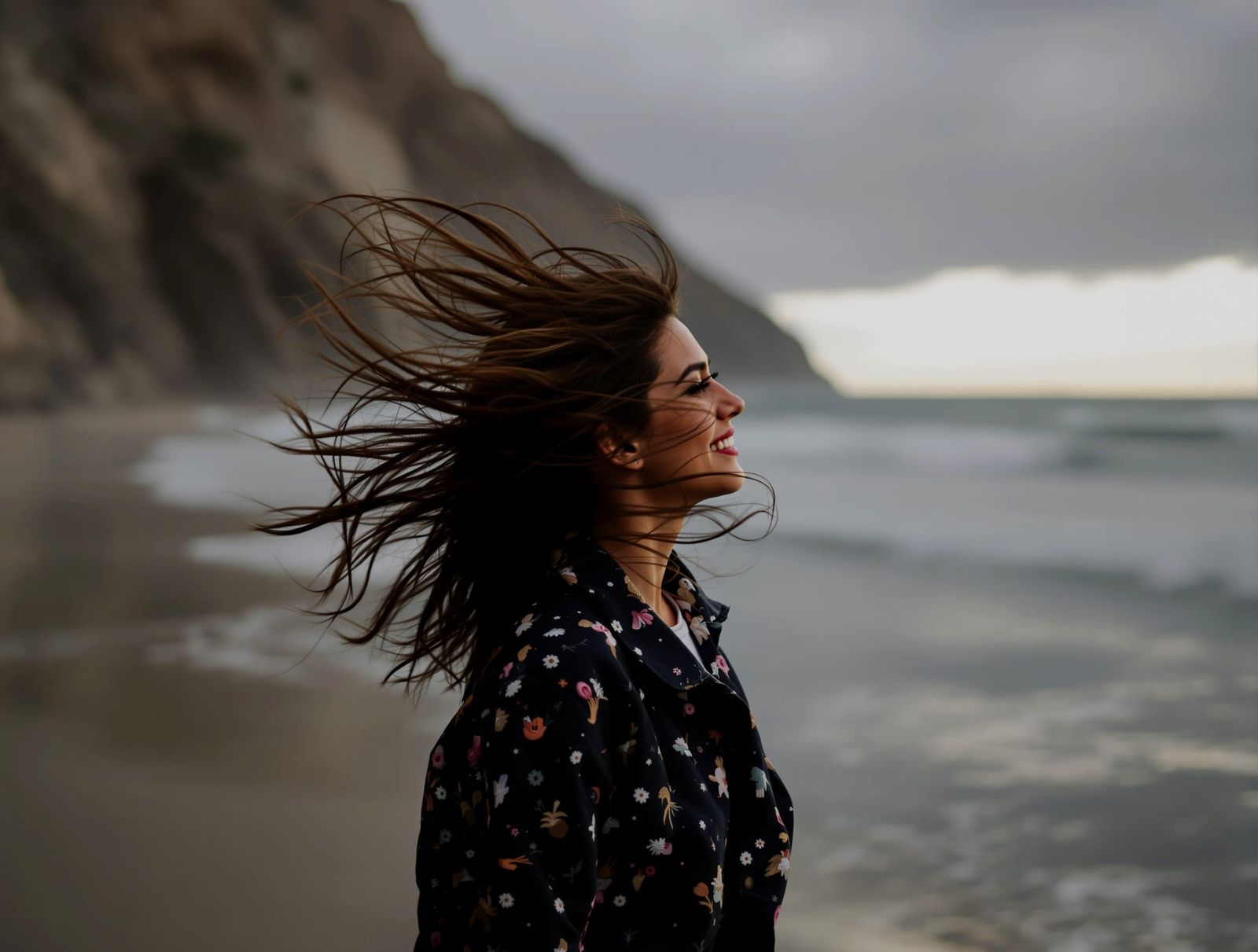 Woman Enjoying a Wind-Swept Sea Breeze
