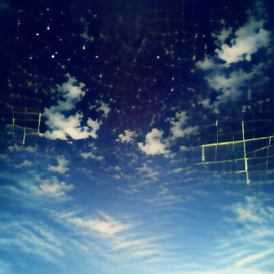 Person Gazing at Sky from Field