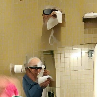 Old Man Wearing Toilet Paper Goggles