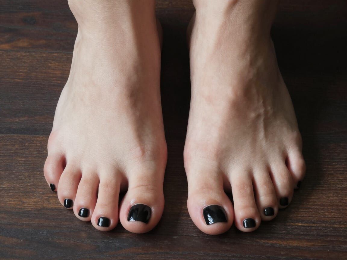 Photorealistic Close-Up of Feet with Glossy Black Toenails