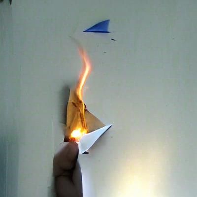 Fiery Paper Airplane in Flight