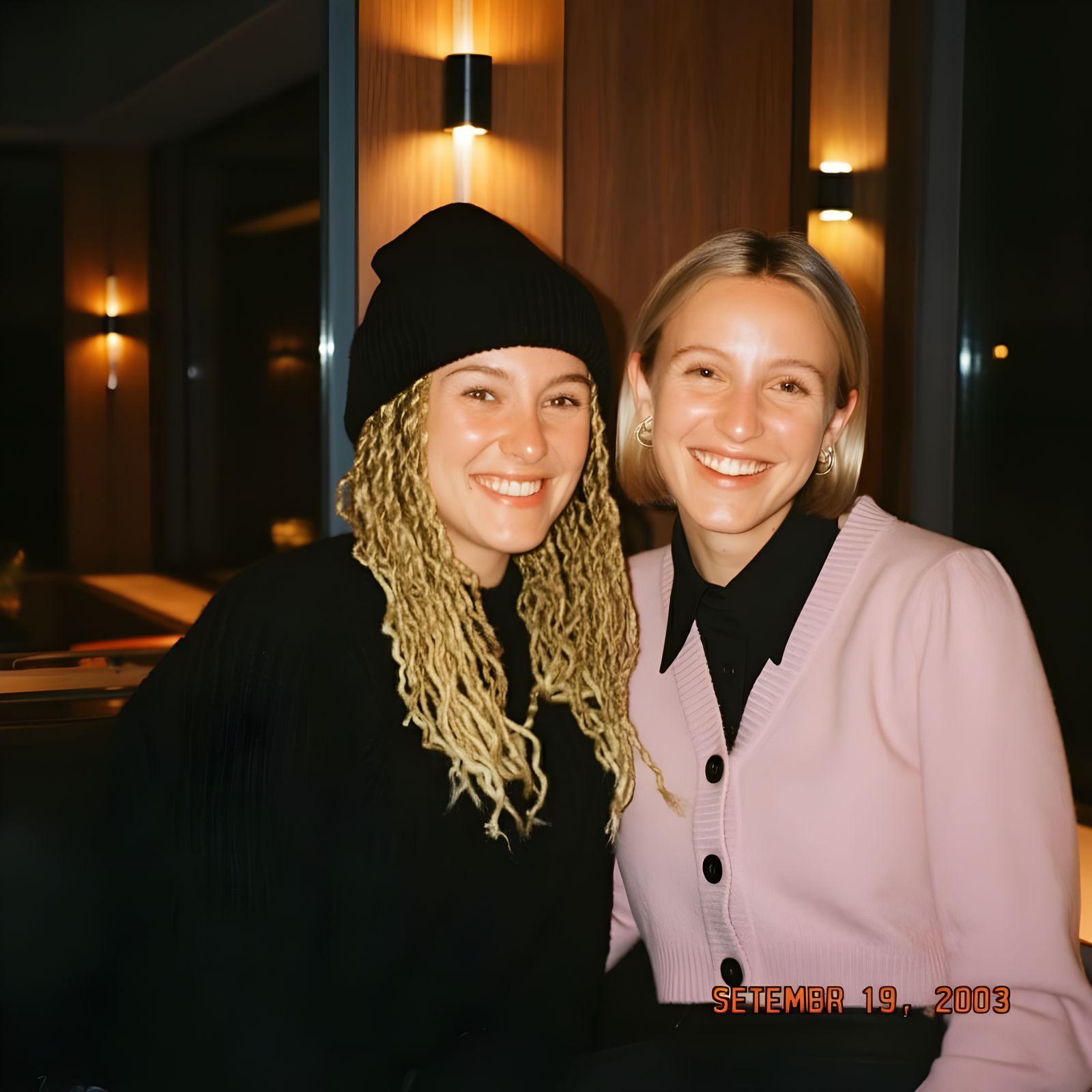 Two Friends Pose Together in a Modern Interior