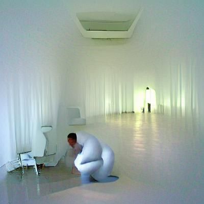 Crouching Man in Minimalist White Room