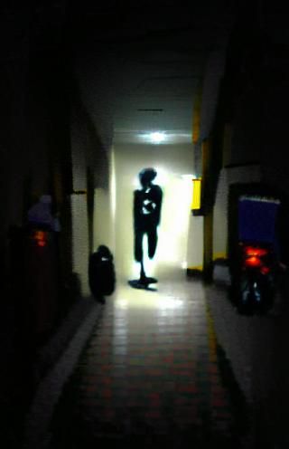 Creepy Dark Figure in VHS Style Hallway