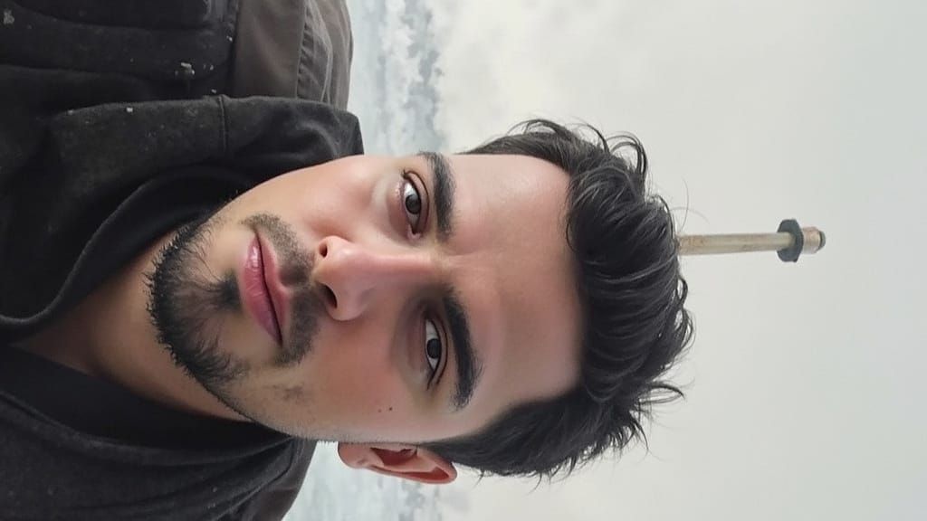 Weathered Lighthouse Against Stormy Seas