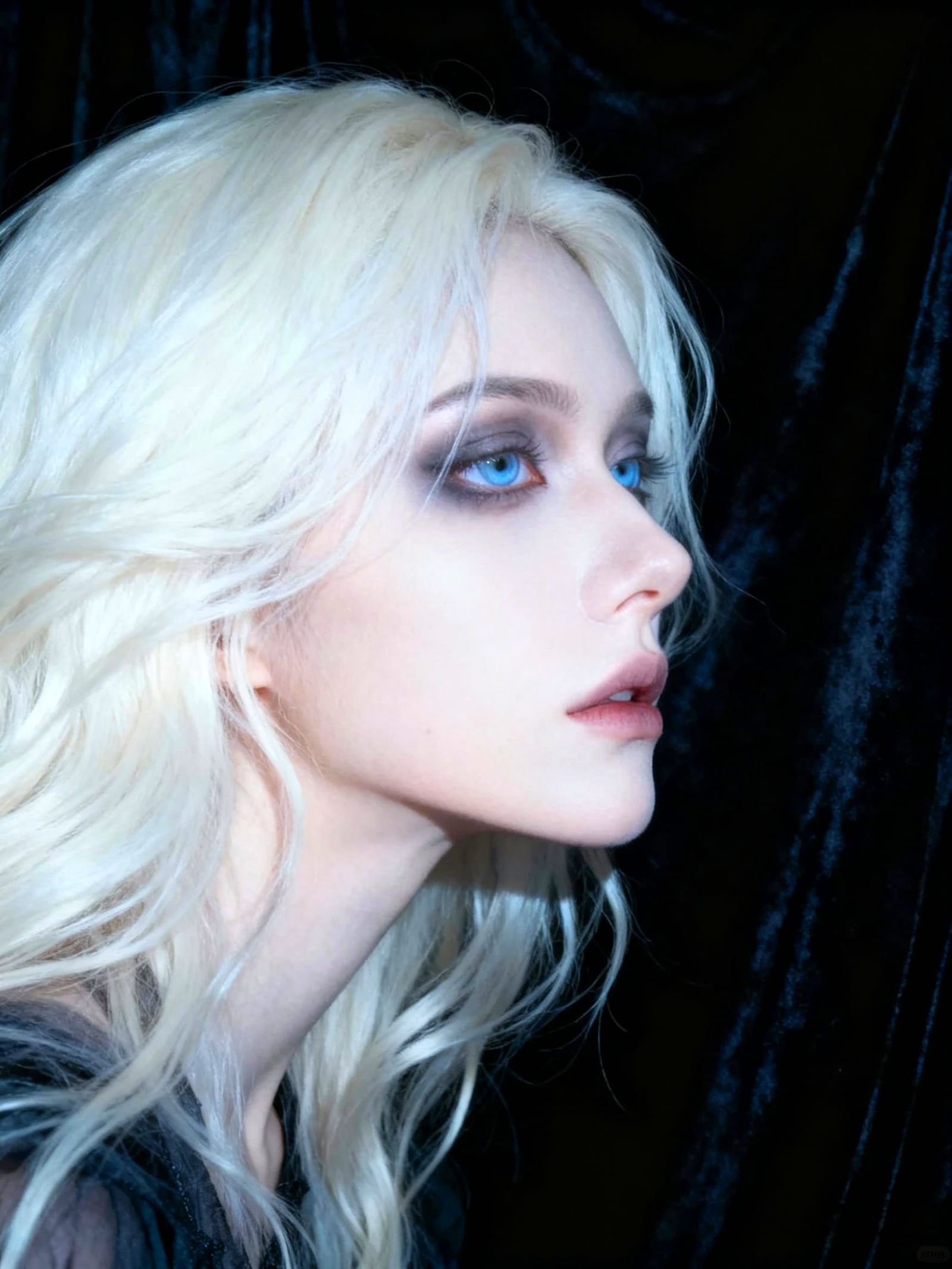 Hauntingly Beautiful Woman with Pale Skin and Blue Eyes