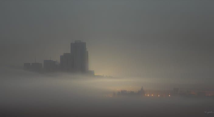 Conceptual art cityscape shrouded in fog, atmospheric wallpa...