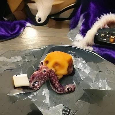 Cartoon Octopus Eating Cheese