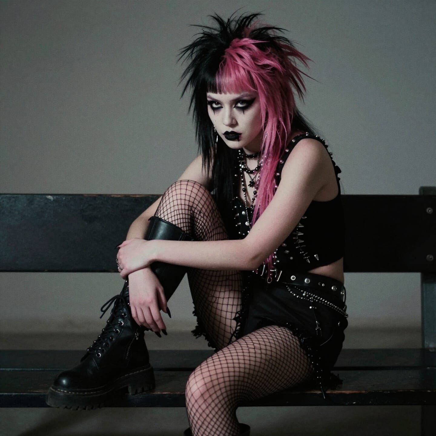 Punk Girl with Pink Hair on Bench