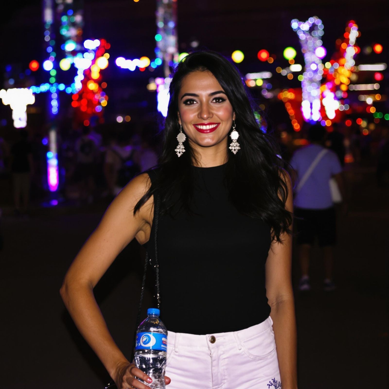 Confident Woman Stands Out at Nighttime Carnival