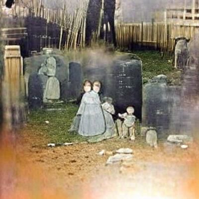 Eerie 1800s Graveyard with Ghost Children