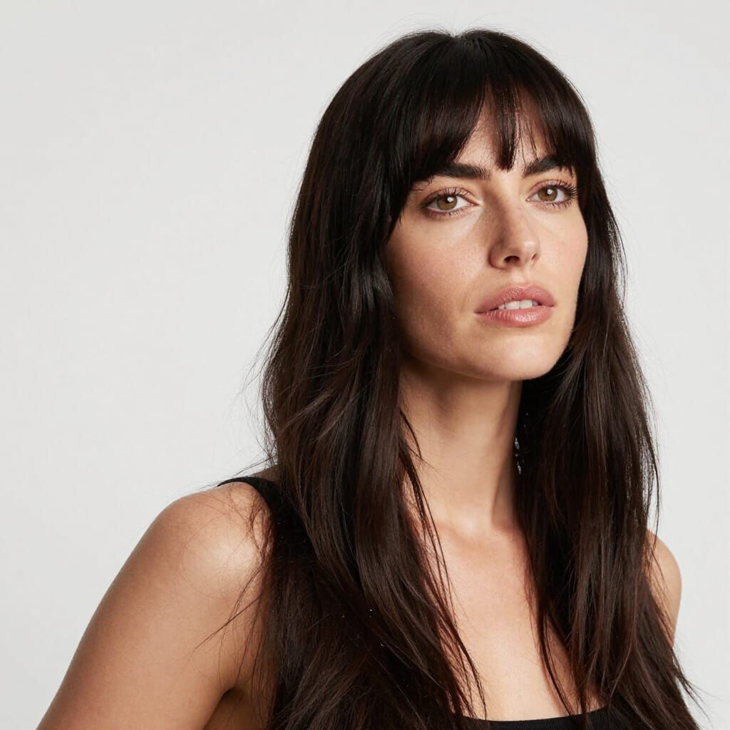 Woman Embracing Optimism with Wild Dark Hair