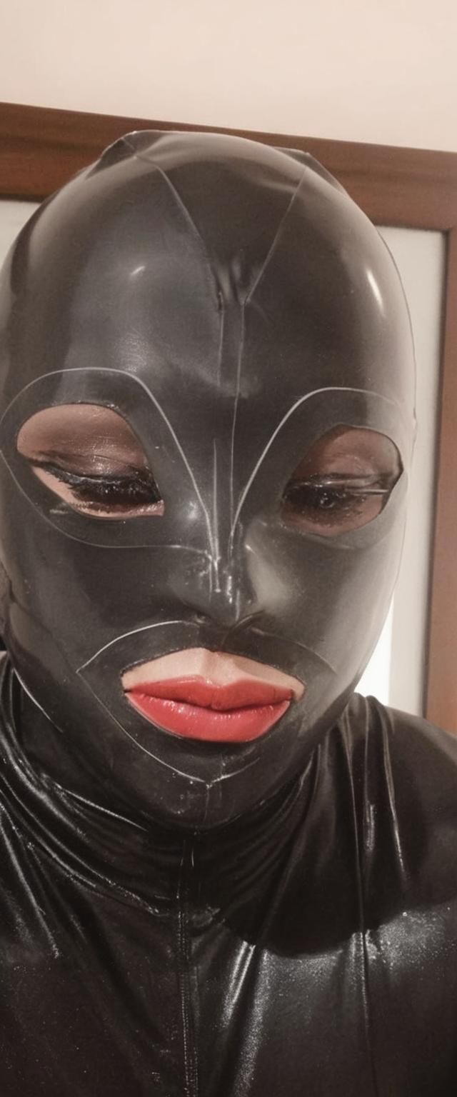 Glossy Latex Bodysuit in Dark, Moody Lighting