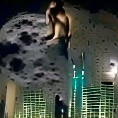 Man on Skyscraper Under Full Moon