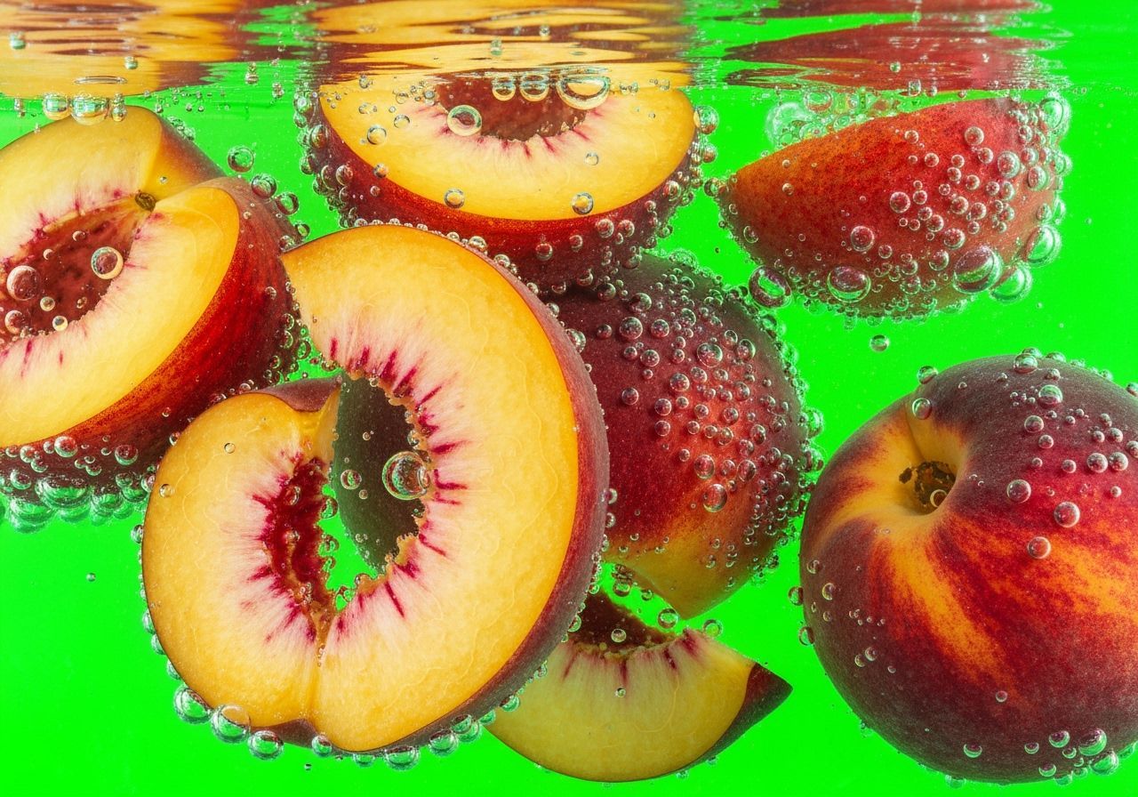 Fresh Peaches Submerged in Water: Macro Photography