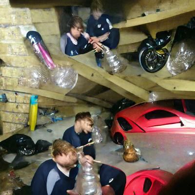 Boys Smoking Bongs in a Garage