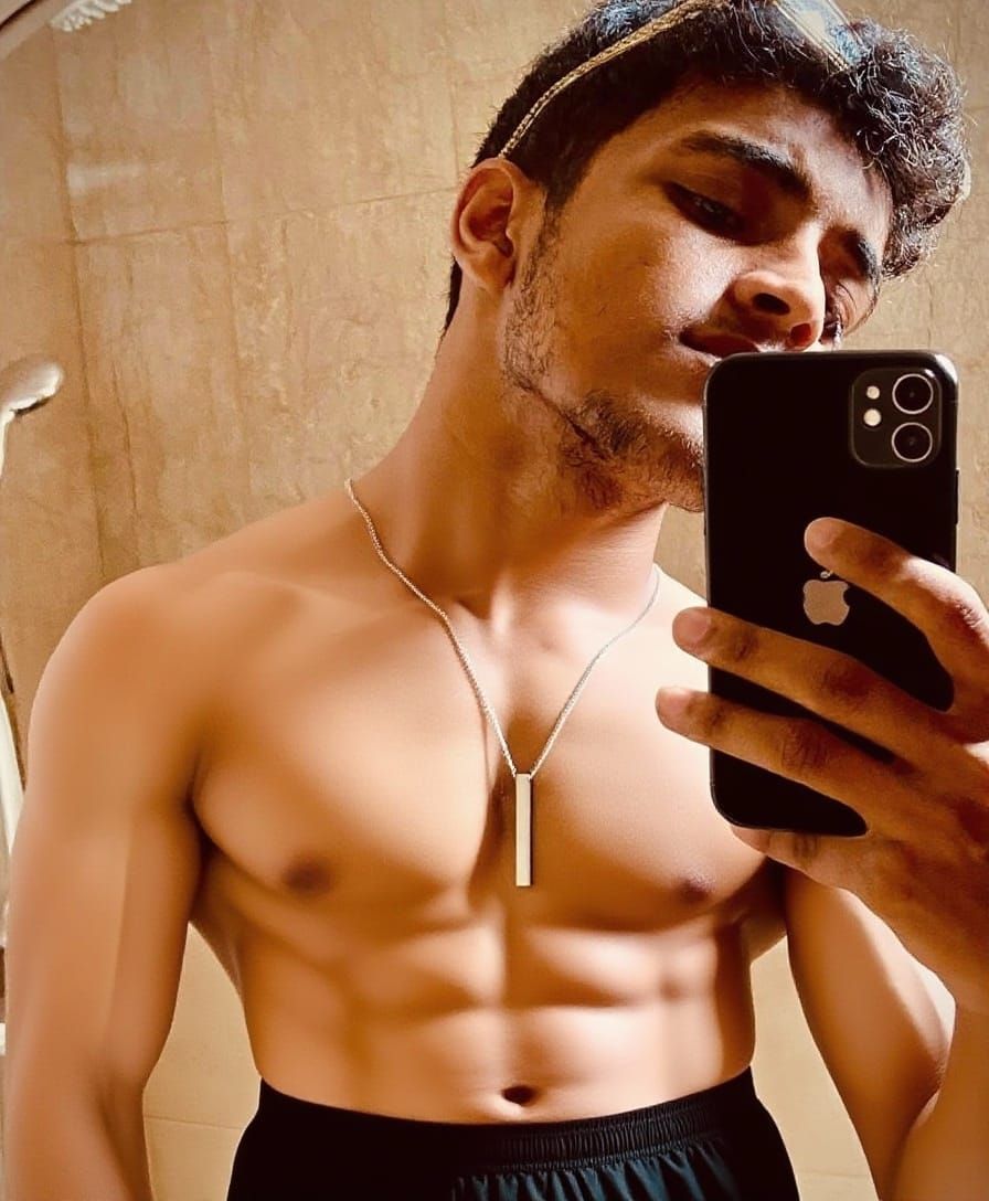 Realistic Photo of Man in Black Boxer Briefs Holding iPhone