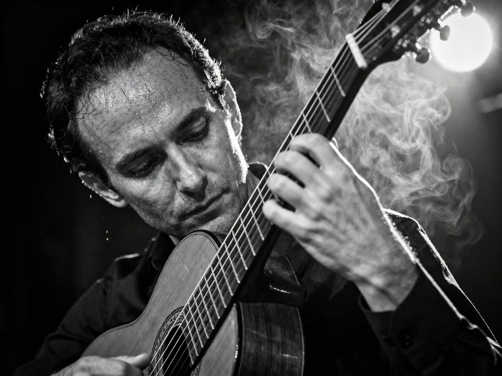 Black and White Guitarist Portrait in Spotlight