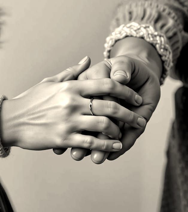 Touching Moment: Young Woman Holds Grandmother's Hand