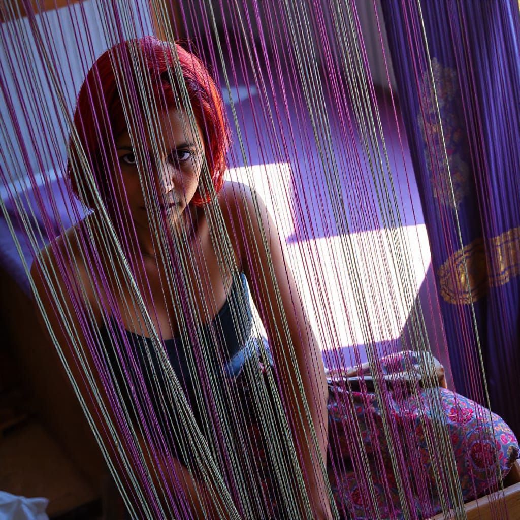 Indian Woman Weaving at Loom in Photorealistic Style