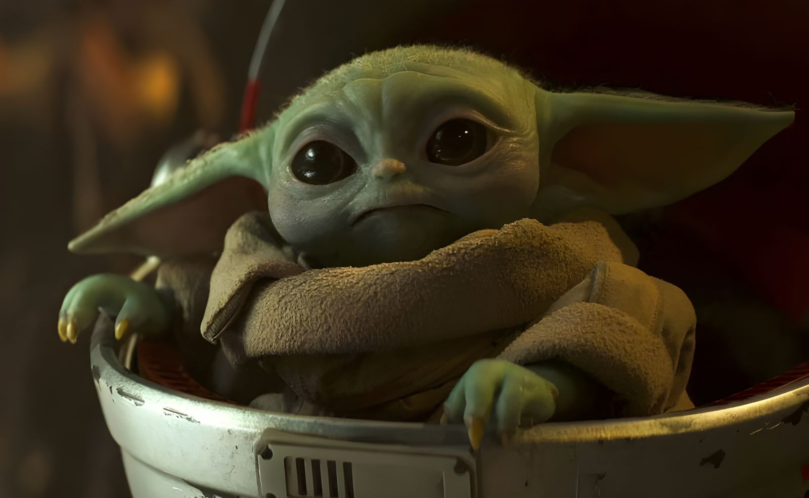 Soldier with Yoda-like Companion in Shoulder Bag