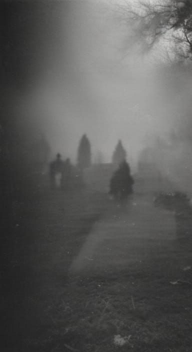 CCTV footage of shadow figures hiding in a dark Romanian cemetary