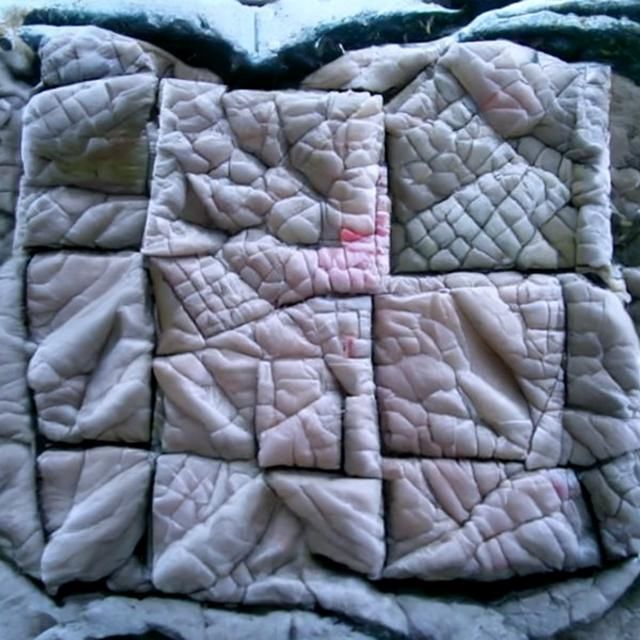 Detailed Quilted Blanket of Tiny Cloth Squares
