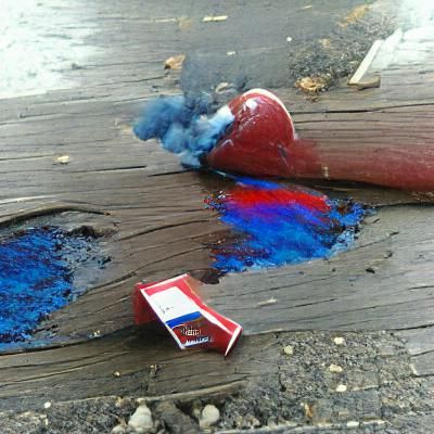 Surreal Red and Blue Oil Spill with Cigarette Smoke