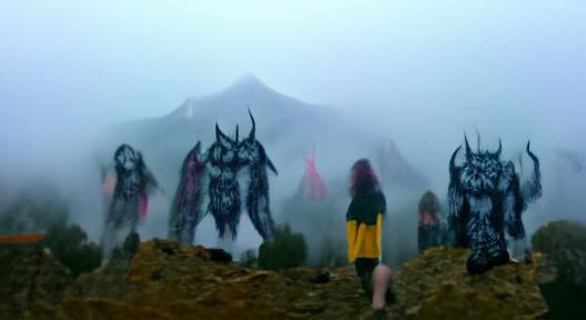 Demons Emerging from Misty Mountain Peaks