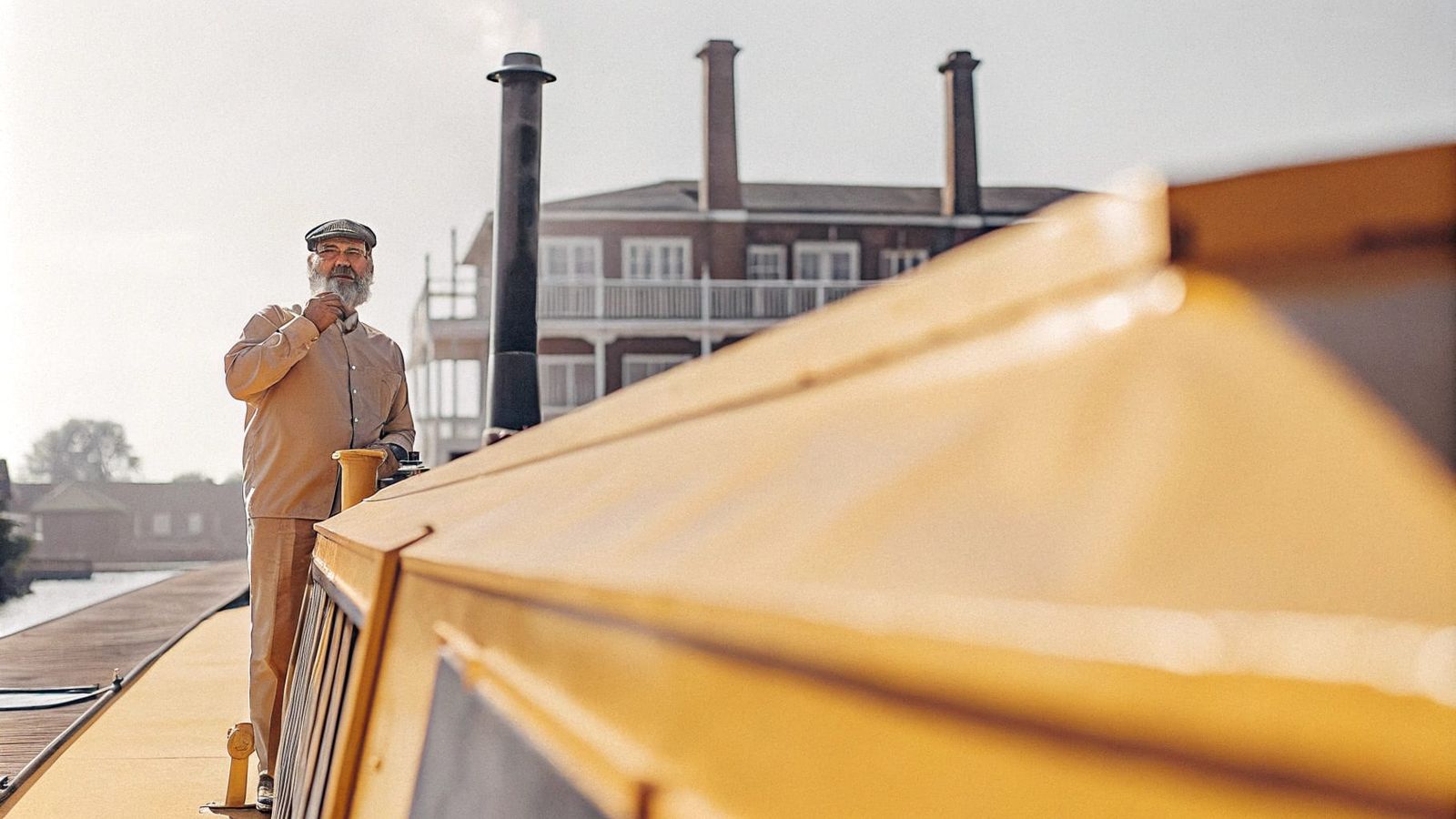 Canal-Side Pub and Serene Narrowboat Scene in the Distance