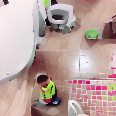 Confused Boy Cries Beside Toilet