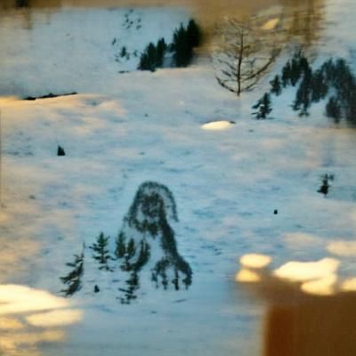 Snowy Mountain Range Under Cloudy Sky