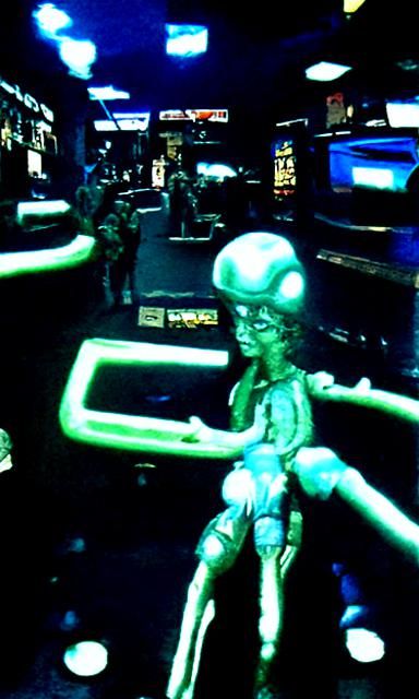 Aliens Play Games in 80s Futuristic Arcade