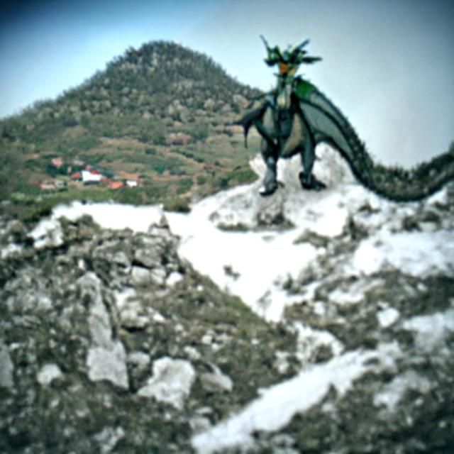 Dragon Perched atop a Mountain Peak
