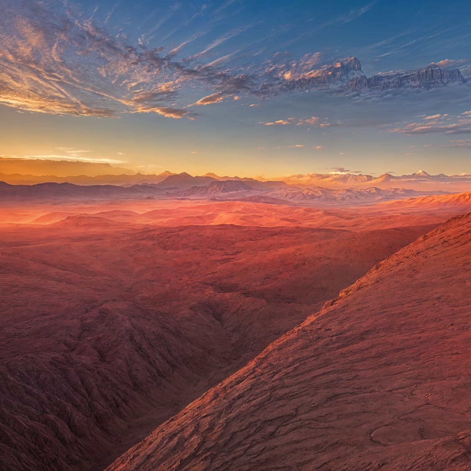 Surreal Desert Sunrise with Majestic Mountains
