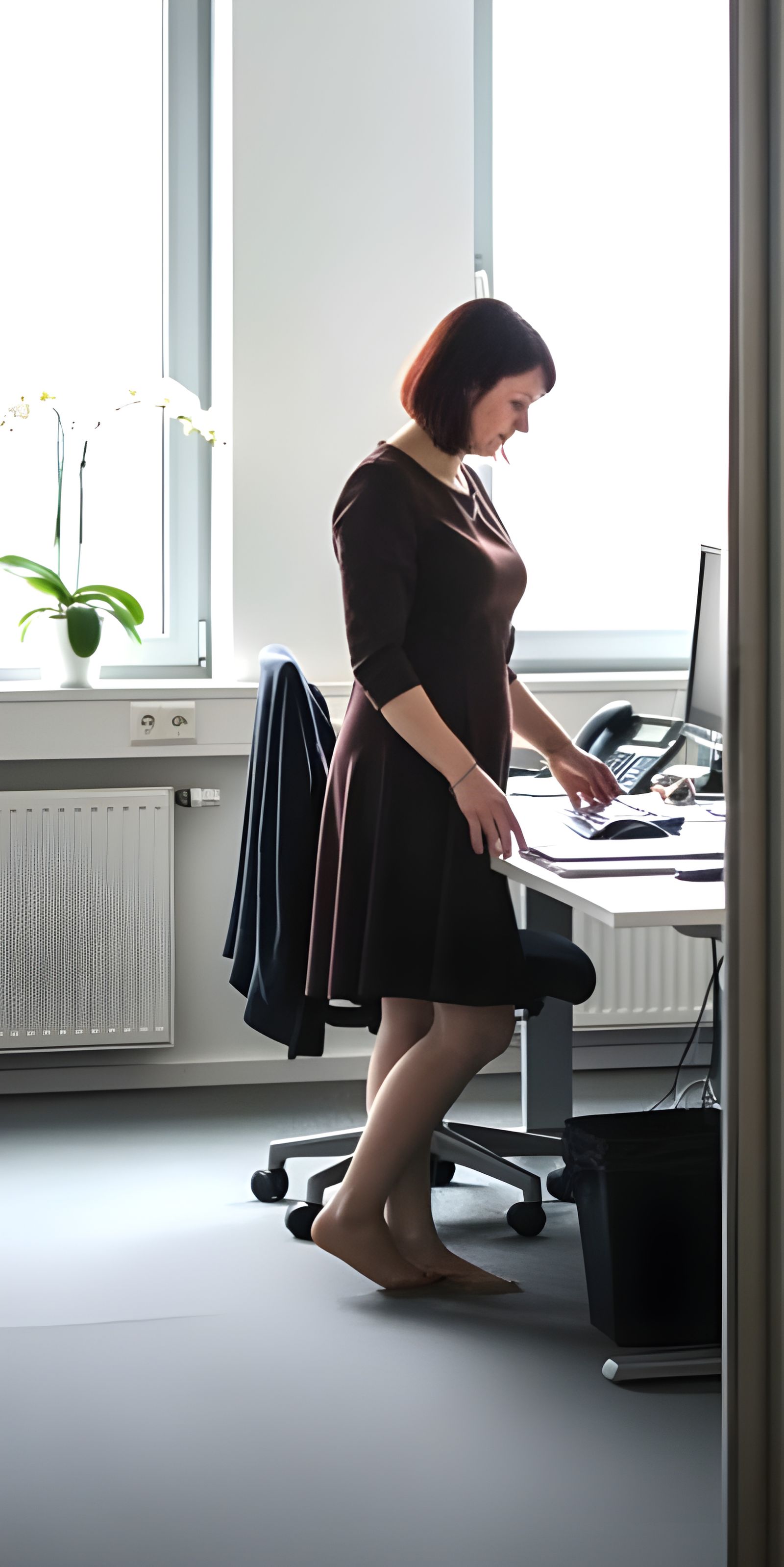 Candid Office Photo: Woman By Desk