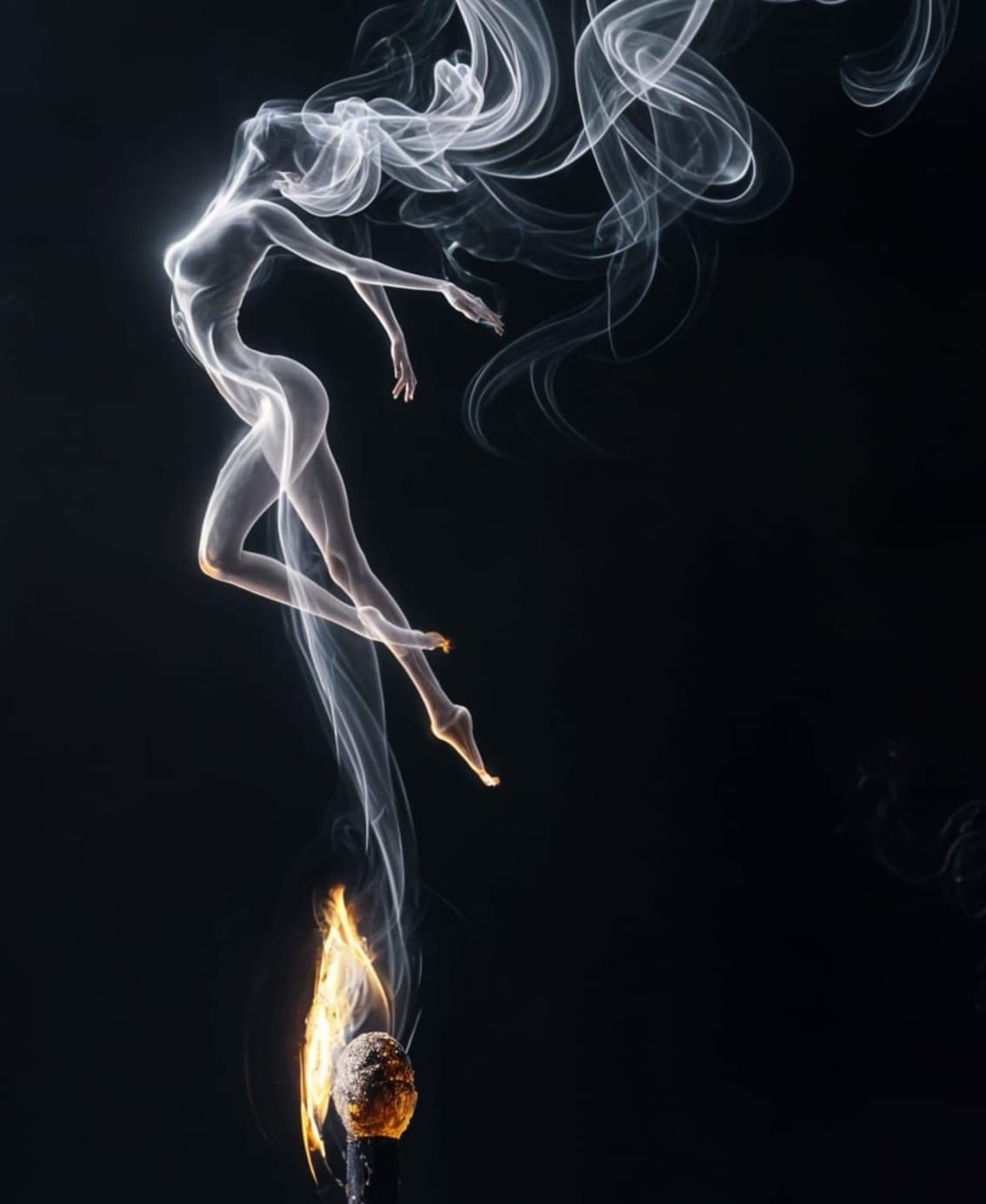 A surreal, artistic photograph of smoke rising from a burnt ...