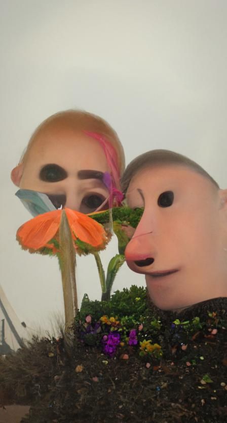 Friends Enjoying Flowers in Sunny Garden