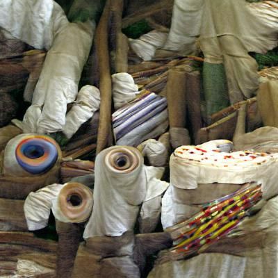 Organized Fabric Sheets and Cloth Rolls Still Life