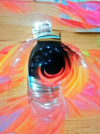Black Hole Trapped: Bright Beauty in a Bottle