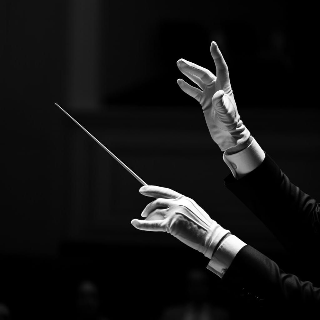 Conductor's Hands Frozen in Dramatic Gesture, High Contrast...